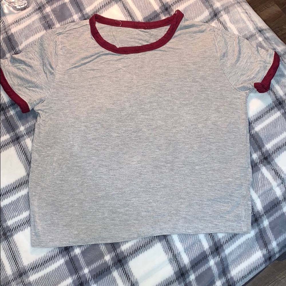 grey shirt with maroon outline